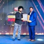 Receiving Red FM Award by Music Director of Kannada Film Industry Mr. Guru Kiran.